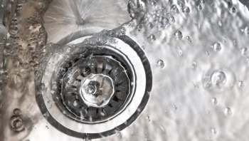 One TikTok user explains how to unclog a kitchen sink with just hot water and soap.