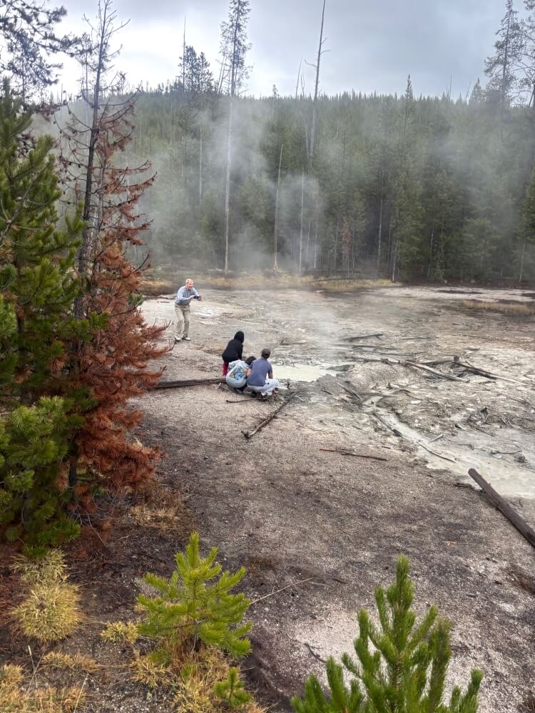 An impassioned bystander caught a family of tourists at Frying Pan Spring in Yellowstone National Park pushing their luck when the family snuck off the designated trails.