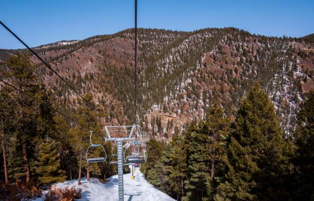 The northern New Mexico ski town of Red River depends heavily on winter visitors, but rising temperatures and a lack of natural snowfall have led to fewer travelers and less income.