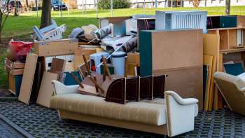 One Reddit user shared a photo of three vintage wooden tables that they found discarded on the curb in their neighborhood.