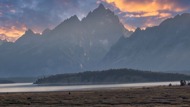 An onlooker at a national park wisely kept their distance while observing other tourists getting dangerously close to a moose.