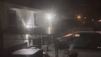 A homeowner shared a video showing a neighbor's powerful outdoor light flashing directly into their window at night.