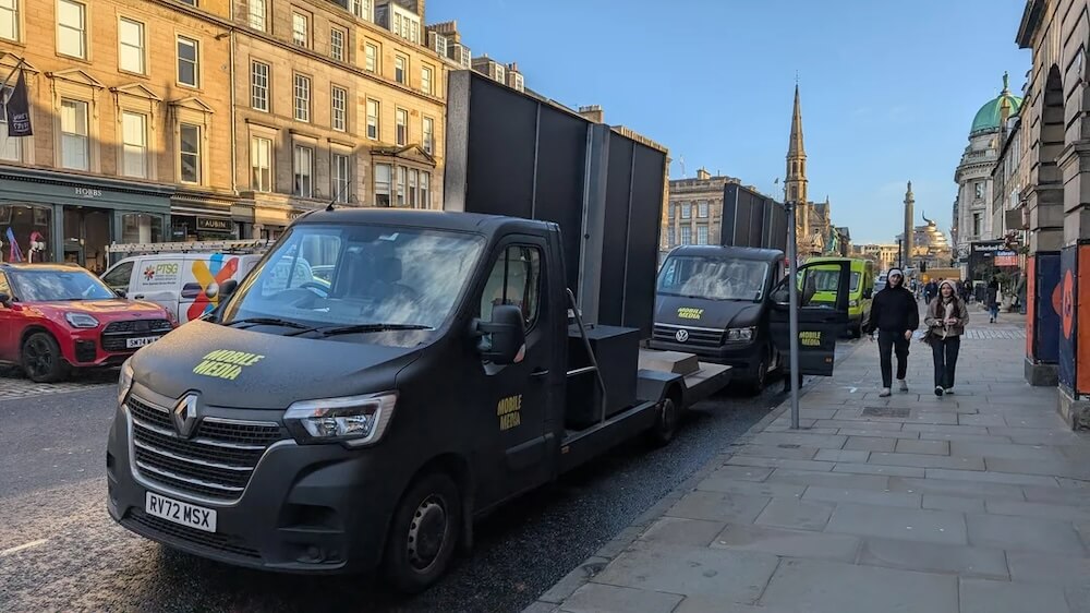 One Redditor shared a photo of trucks with billboards set up in the back and wrote, "These 'Mobile Media' trucks are annoying, driving billboards."