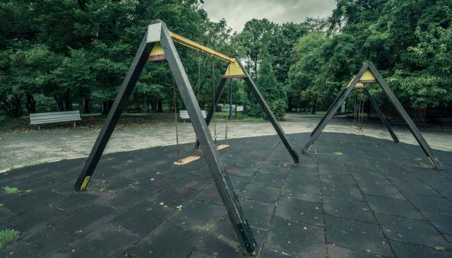 A man was arrested after he allegedly illegally dumped dangerous construction materials in a children's play area.