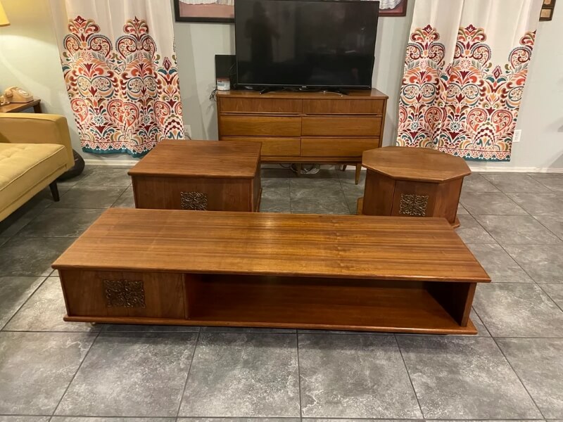 One Reddit user shared a photo of three vintage wooden tables that they found discarded on the curb in their neighborhood.