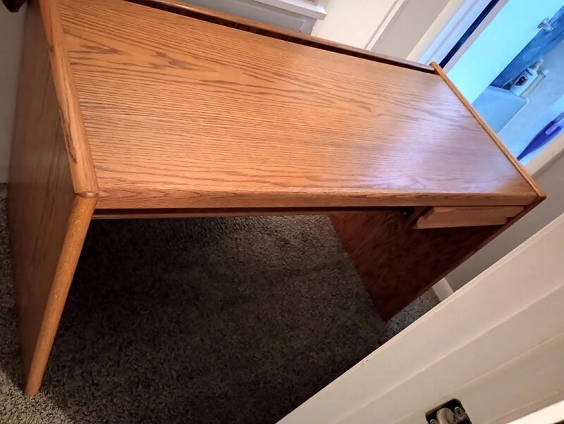 One Redditor shared how they saved thousands of dollars by rescuing a curbside desk and revealed a clever hack for avoiding awkward interactions.