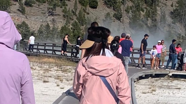 Photos were posted of tourists taking pictures on a protected tundra ecosystem in Rocky Mountain National Park.