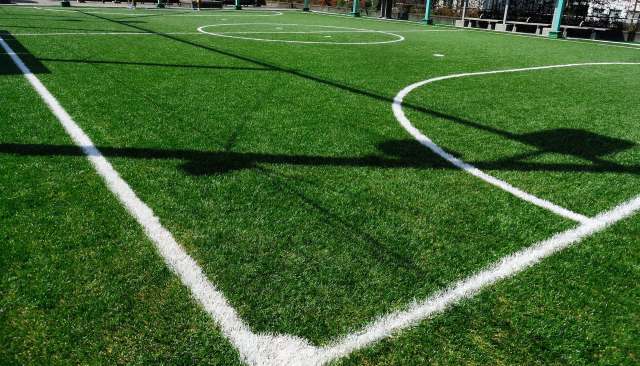 A business owner and local sports fan in Vermont is pushing to replace the grass athletic fields at his town's high school with artificial turf.