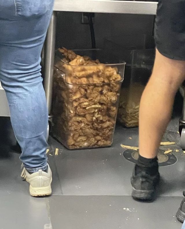A Raising Cane's employee posted a photo to r/mildlyinfuriating showing a large container filled with discarded chicken tenders.