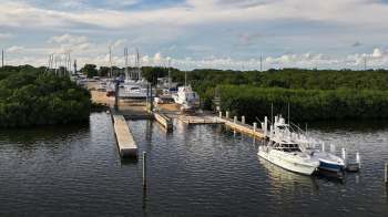 A 55-foot yacht sank in Key Largo, leaking gallons of diesel into the water and threatening the Florida Keys.
