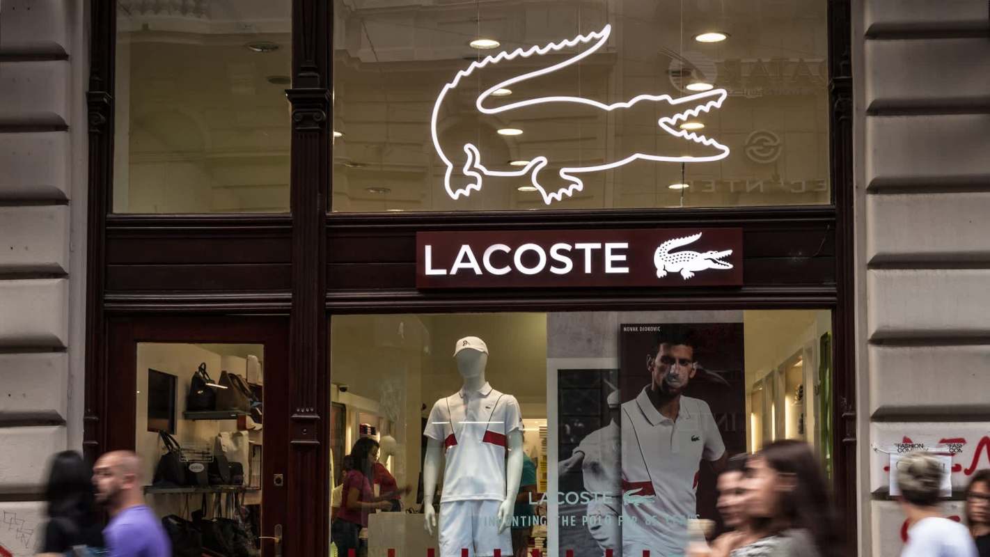 A Redditor shared a photo on r/LateStageCapitalism featuring a dumpster overflowing with Lacoste shoes.