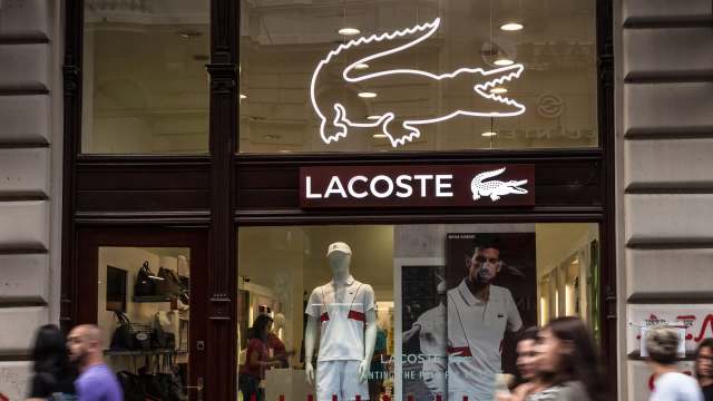 A Redditor shared a photo on r/LateStageCapitalism featuring a dumpster overflowing with Lacoste shoes.