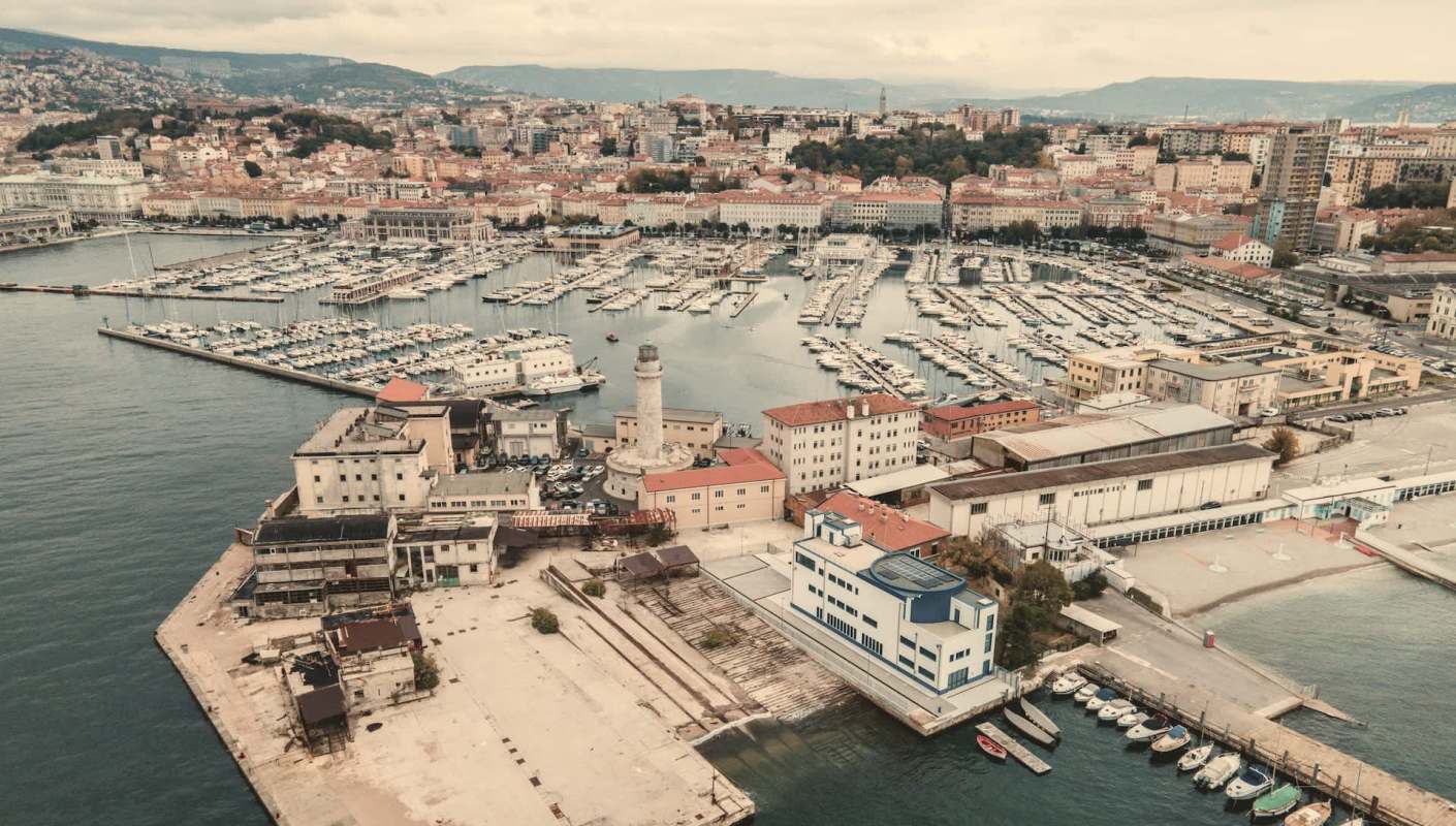 Residents of Trieste, Italy, are expressing growing frustration and anger as a giant symbol of excess looms over their harbor.
