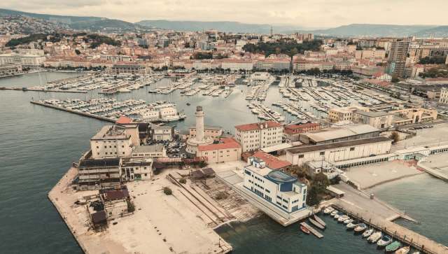 Residents of Trieste, Italy, are expressing growing frustration and anger as a giant symbol of excess looms over their harbor.