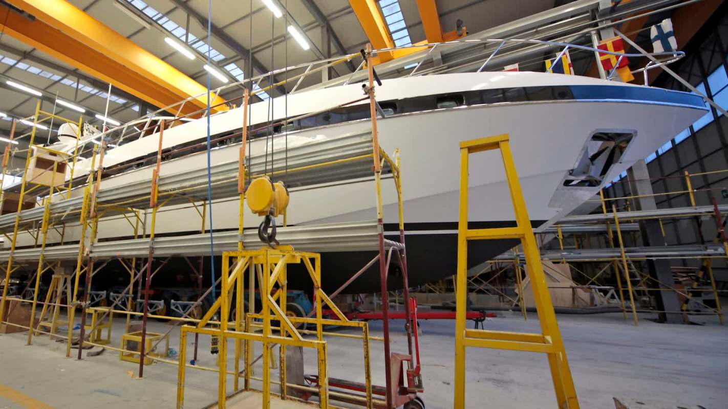 A half-finished superyacht was ferried between multiple ports for a decade until its final owner was forced to construct an entire shipyard just to finish it.