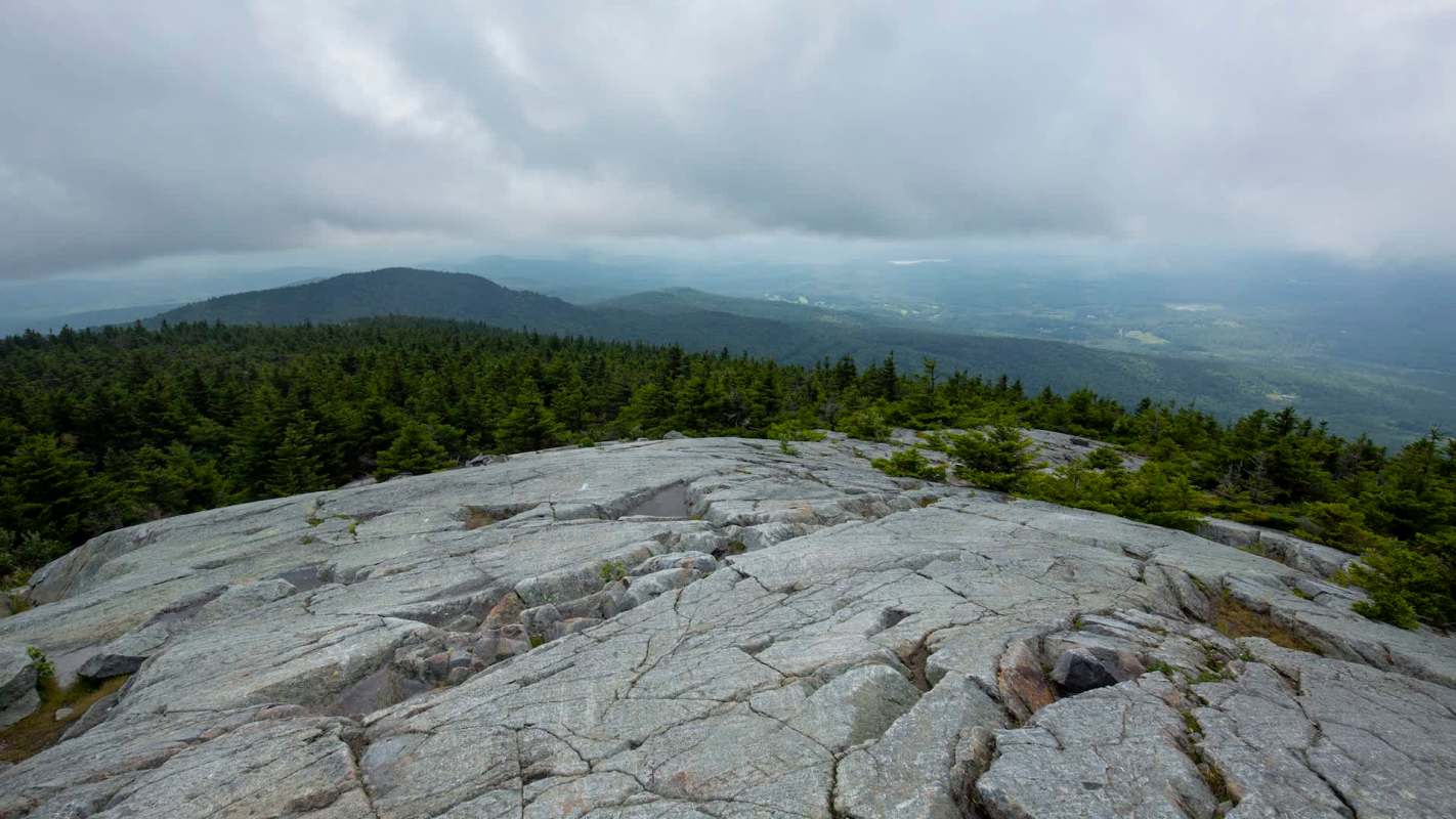 A hiker shared their frustrating experience of stumbling upon a vandalized stone structure along Winslow's Trail in New Hampshire.