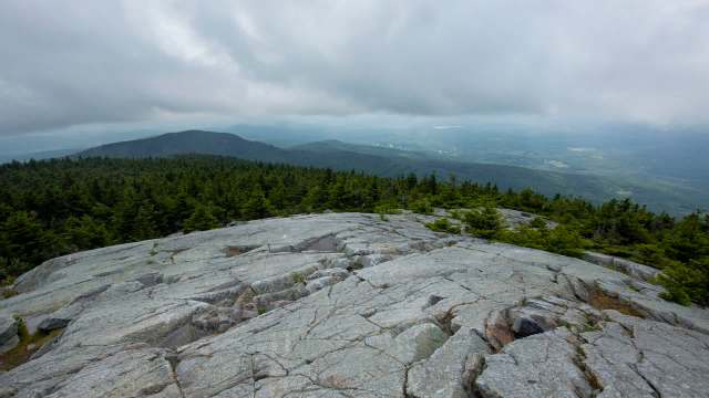 A hiker shared their frustrating experience of stumbling upon a vandalized stone structure along Winslow's Trail in New Hampshire.