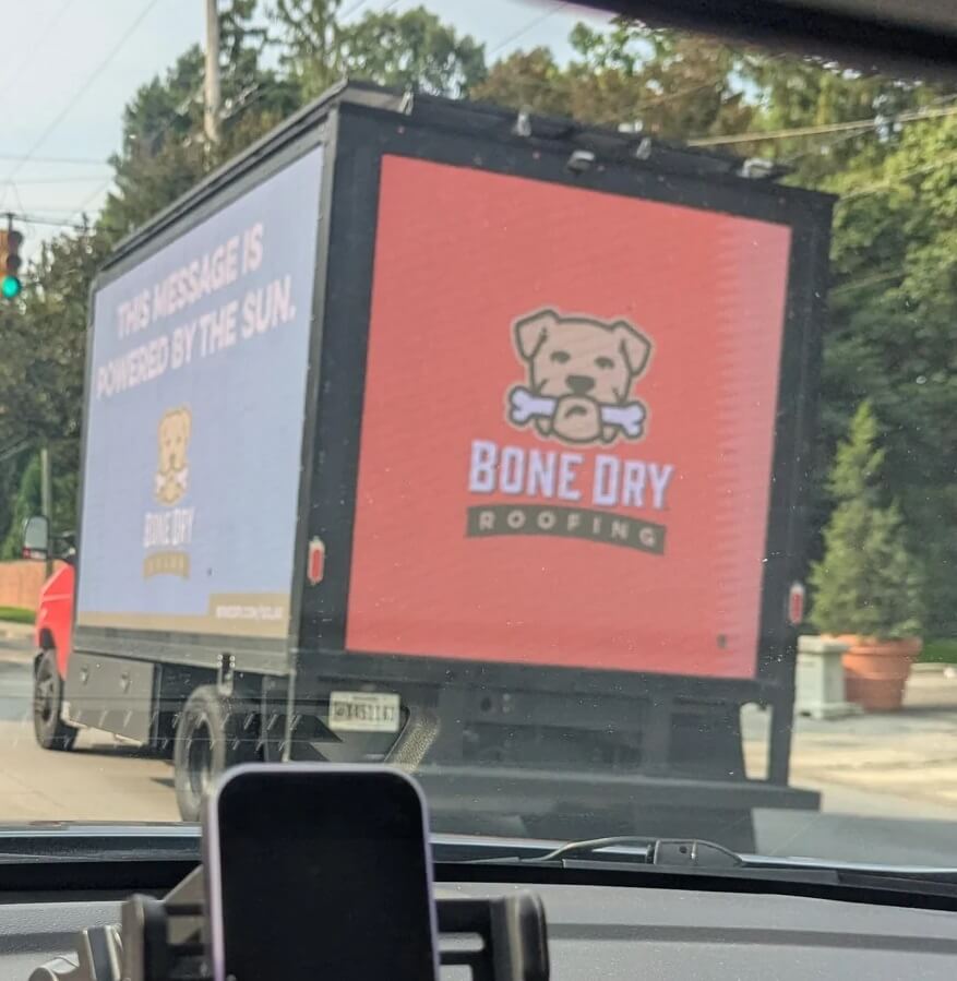 An Indianapolis driver almost crashed because of a moving advertisement on the road.