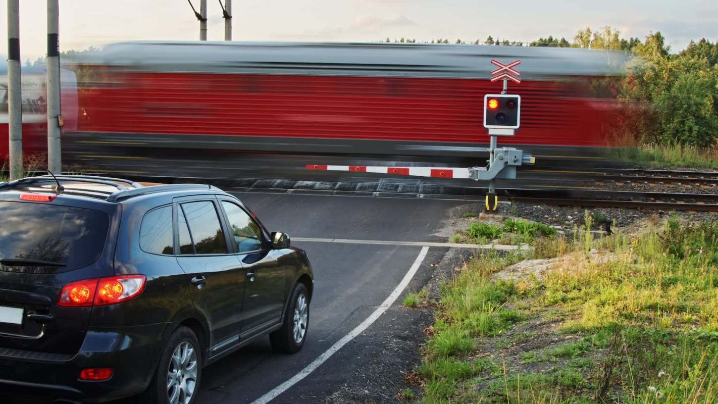 A shocking dashcam clip that made the rounds on Reddit left viewers stunned after a driver risked their life — and others' — to beat a train at a railroad crossing.