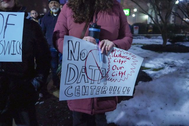 Ben Dziobek had the privilege of being the first to announce to his fellow protesters that their plan had worked: New Brunswick City Council killed its plans to build the data center, deciding to build a public park in the area instead.