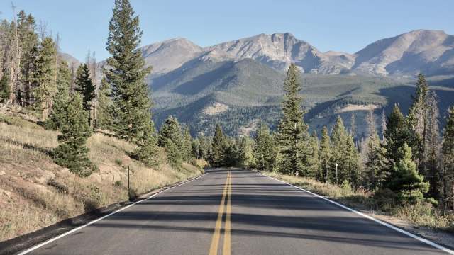 Two Instagram photos showed visitors to Estes Park in Colorado standing dangerously close to a wild elk.