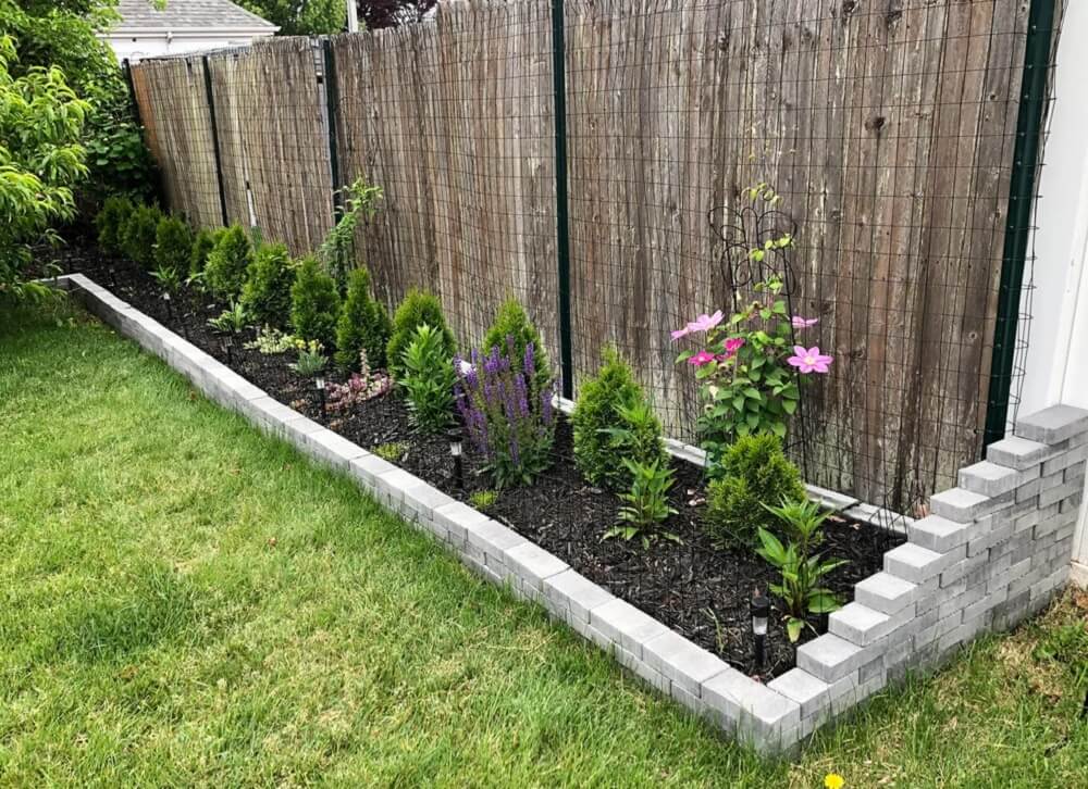 One Redditor shared their side flower garden's progress over three years.