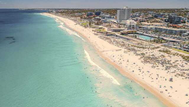 Drone footage captured a terrifying encounter between a golden doodle and a tiger shark in Western Australia.