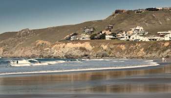 A California surfer narrowly escaped a great white shark encounter after being struck from below.