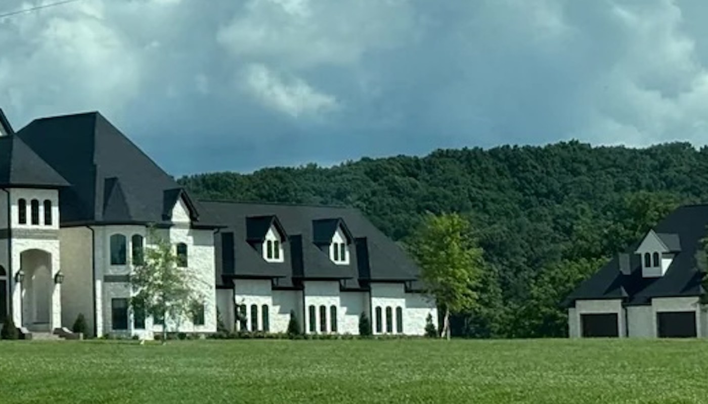 One Redditor spotted a pair of gaudy houses while visiting their parents and managed to dig up the story behind the McMansion competition.