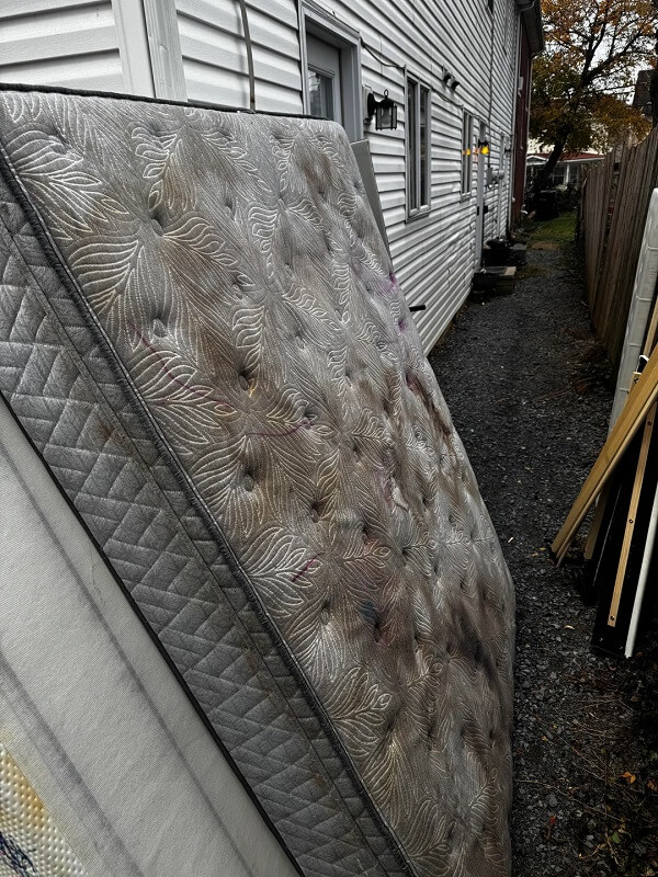 One Reddit user shared how their neighbor blocked their narrow alleyway with discarded furniture and garbage.