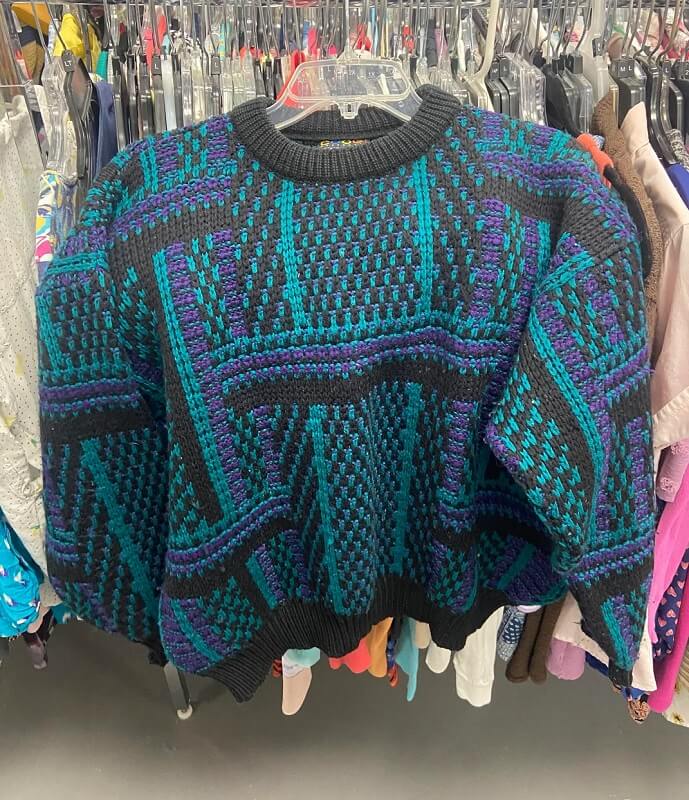 A shopper discovered a high-end Coogi sweater for literal pennies on the dollar at a thrift store.