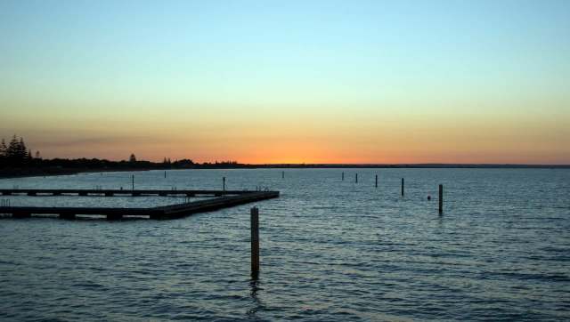 A teen swam miles to get help after his mother and two siblings were swept out to sea on a paddleboard.