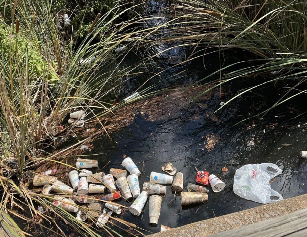 One Redditor shared a photo of a polluted Norman, Oklahoma, waterway full of fast-food cups.