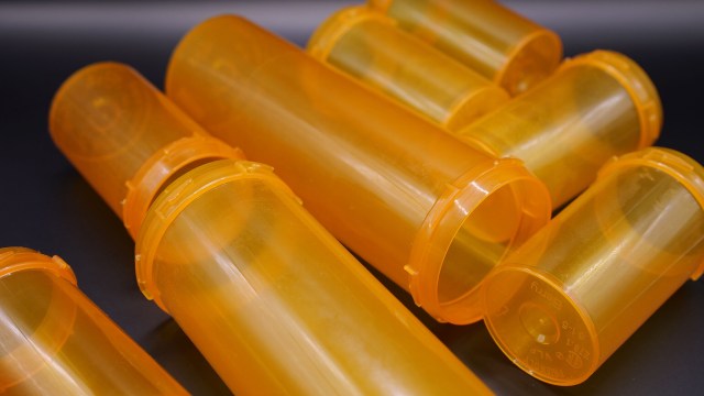Discover how to make a stylish DIY light fixture using recycled pill bottles in this fun crafting project.