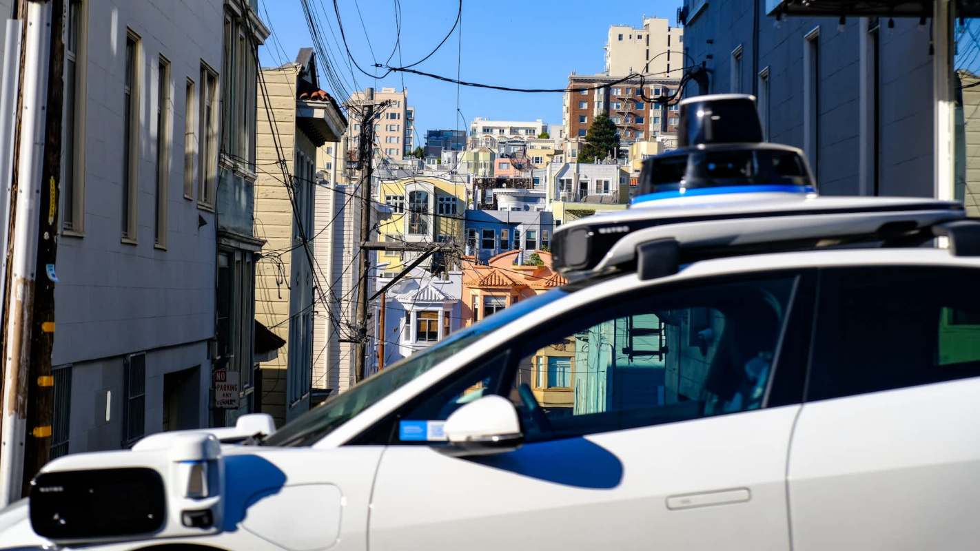 Waymo relies on overseas workers in the Philippines to guide its supposedly self-driving vehicles through tricky situations, raising major questions about safety and transparency.