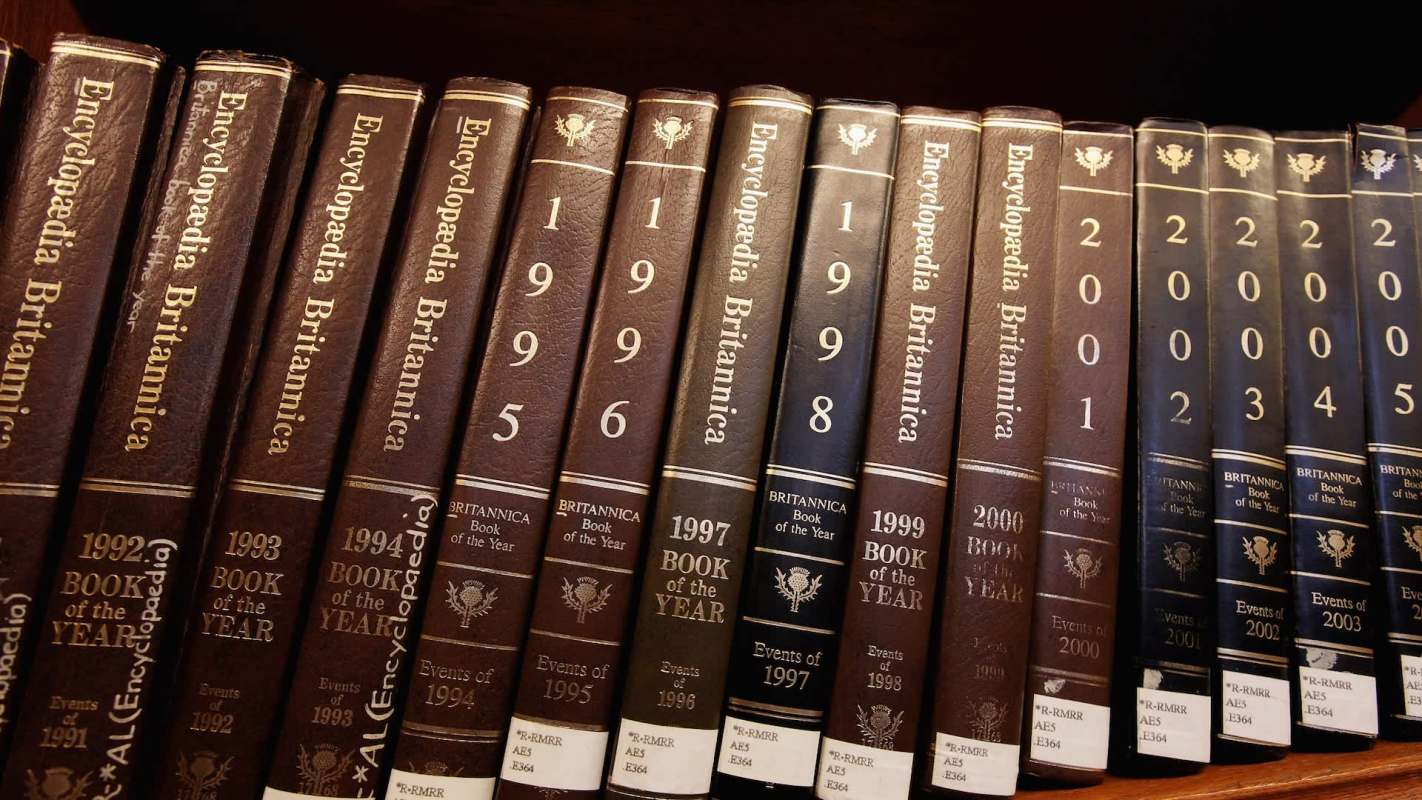 Encyclopedia Britannica books on a shelf.