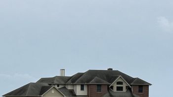 A contributor in the r/McMansionHell subreddit was frustrated to spot, not one, but two large houses surrounded by unattractive lawns in an area that they otherwise love.