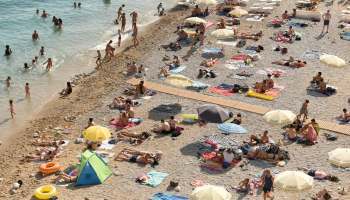 Many people's beach experiences are being ruined by intrusive advertisements that block serene views.