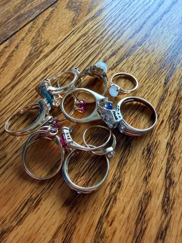 Multiple rings on a wooden table.