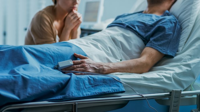 A patient recovering from a tick bite in a hospital with a visitor.