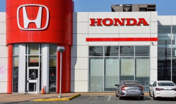 Honda reported its first annual loss in seven decades, citing a massive $15.7 billion in unanticipated restructuring costs.