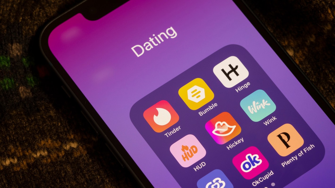 A smartphone screen displays a "Dating" folder with various dating app icons on a purple background.