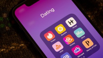 A smartphone screen displays a "Dating" folder with various dating app icons on a purple background.