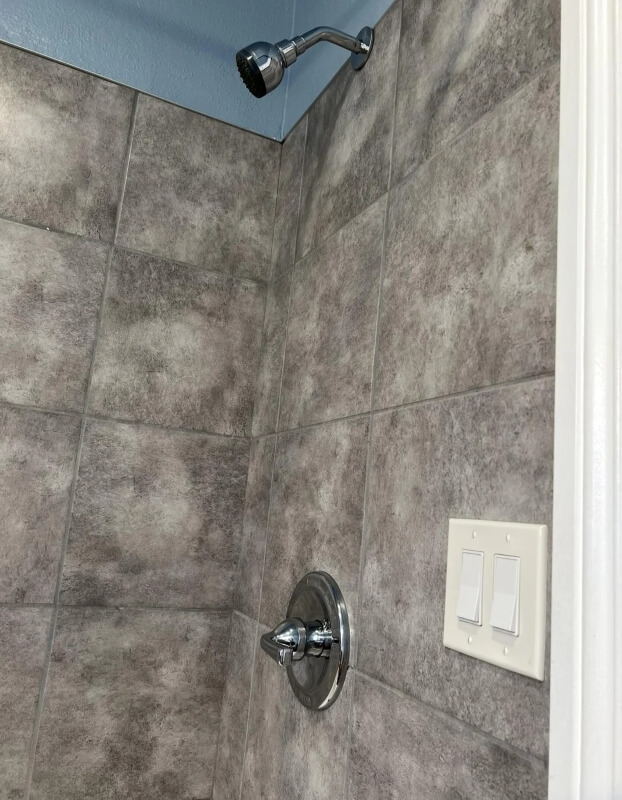 A renter shared their unusual bathroom discovery of a light switch just feet from a showerhead to the r/LandlordLove subreddit.