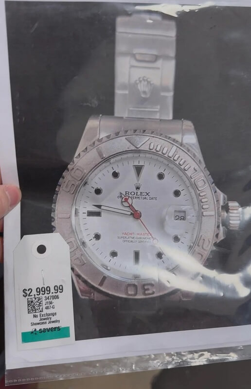 A watch with a Rolex logo and a price tag of $2,999.99.