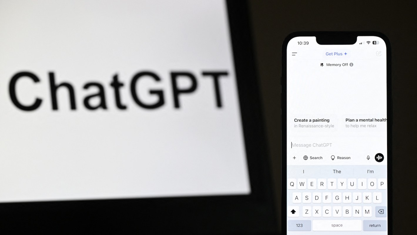 A smartphone displaying the ChatGPT interface next to a blurred screen featuring the ChatGPT logo.