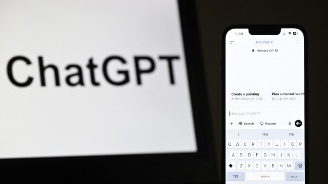 A smartphone displaying the ChatGPT interface next to a blurred screen featuring the ChatGPT logo.