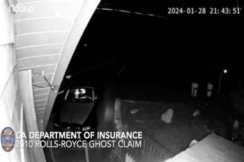 A surveillance image shows a 2010 Rolls-Royce Ghost parked outside in dim lighting.