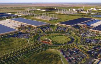 An artist's rendering of an aerial view of a large data center facility with parking areas and power infrastructure.