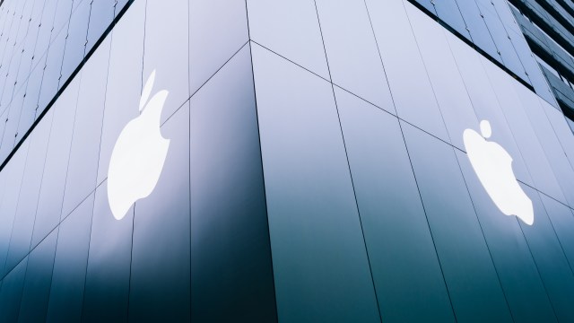 A glass building with two Apple logos on it.